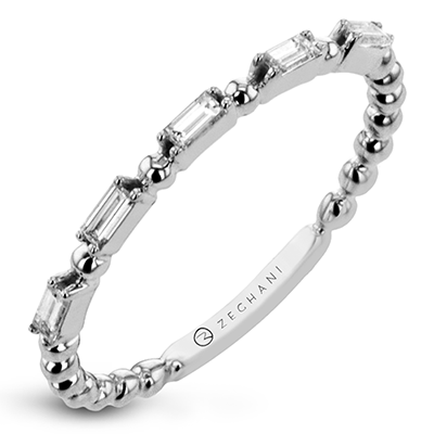 Photo of "Collette" Baguette Band in a decorative scene, designed by , available at Plumb Gold & Plumb Silver
