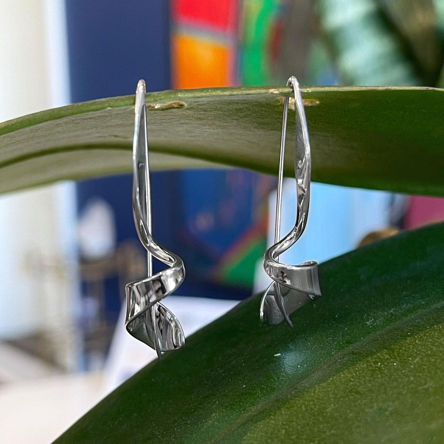 Photo of "Corkscrew" Earrings in a decorative scene, designed by , available at Plumb Gold & Plumb Silver