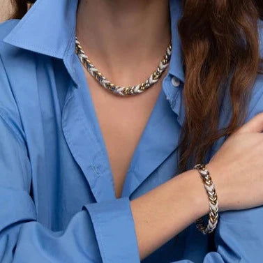 Photo of Cubic Zirconia Braided Link Necklace in a decorative scene, designed by , available at Plumb Gold & Plumb Silver