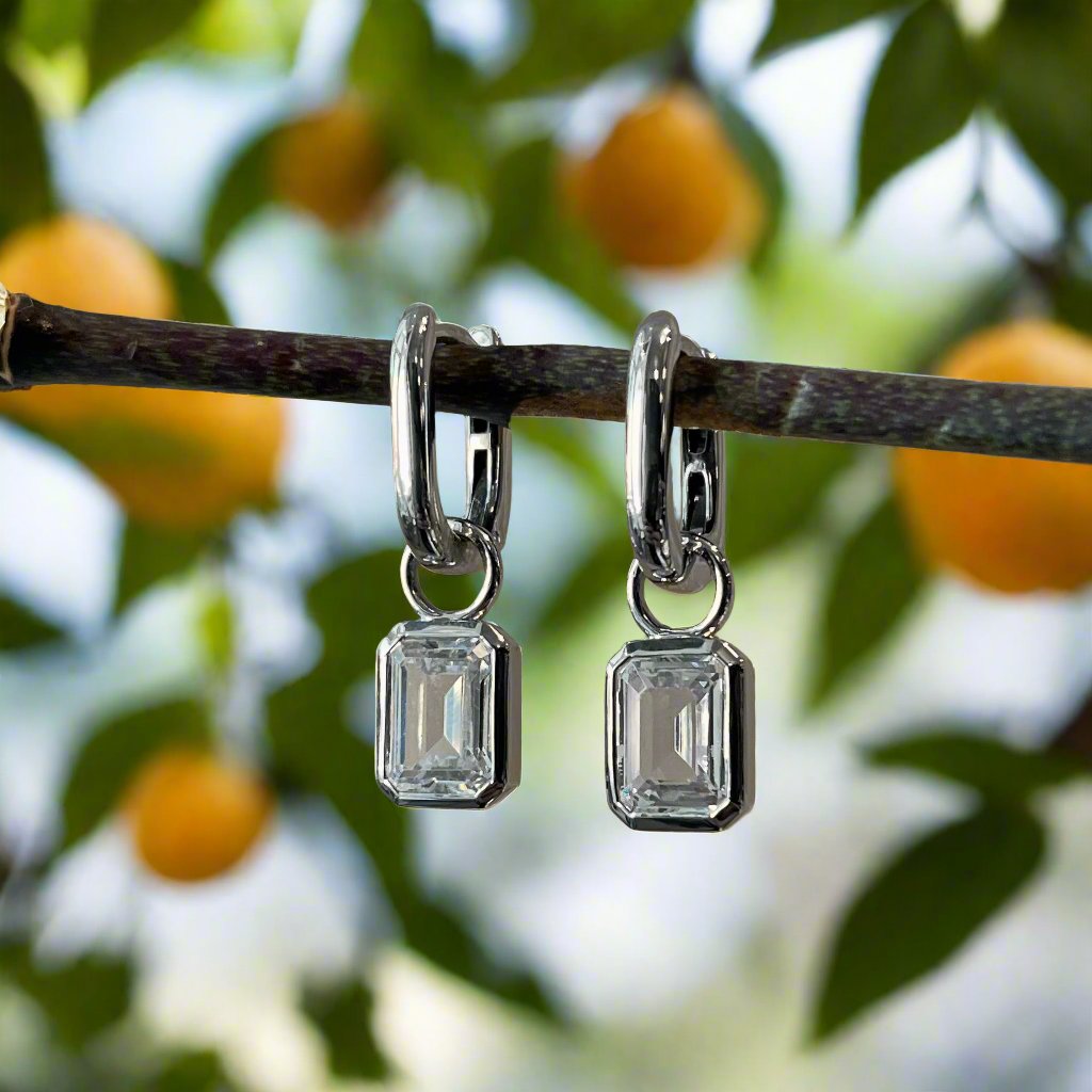 Photo of Cubic Zirconia Earring Charms in a decorative scene, designed by , available at Plumb Gold & Plumb Silver
