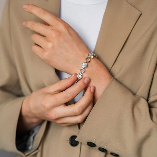 Photo of Cubic Zirconia Fancy Link Bracelet in a decorative scene, designed by , available at Plumb Gold & Plumb Silver