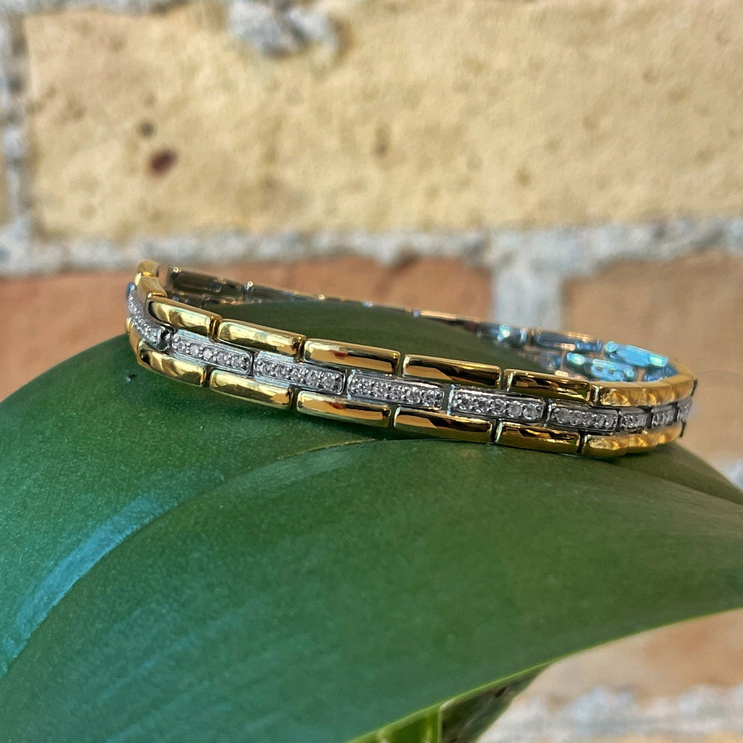 Photo of Cubic Zirconia Fancy Link Bracelet in a decorative scene, designed by , available at Plumb Gold & Plumb Silver