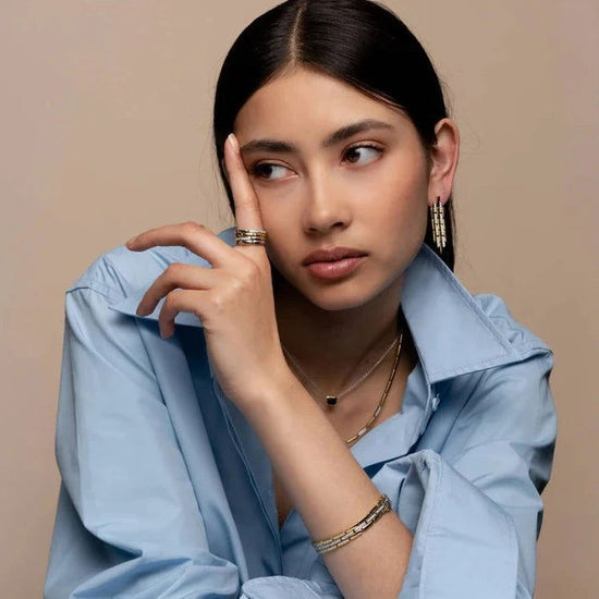 Photo of Cubic Zirconia Fancy Link Bracelet in a decorative scene, designed by , available at Plumb Gold & Plumb Silver