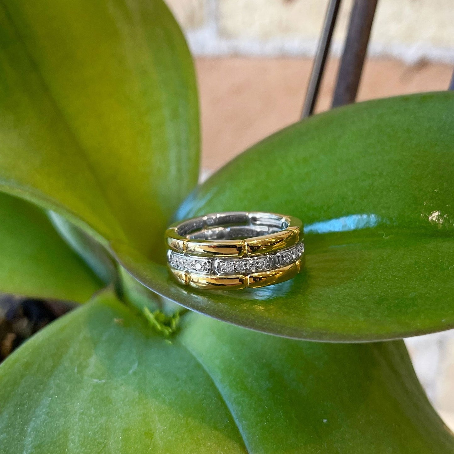 Photo of Cubic Zirconia Fancy Link Ring in a decorative scene, designed by , available at Plumb Gold & Plumb Silver