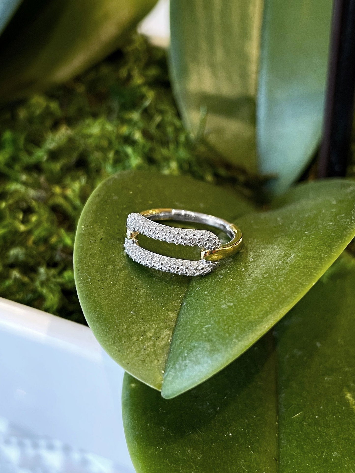 Photo of Cubic Zirconia Oval Ring in a decorative scene, designed by , available at Plumb Gold & Plumb Silver