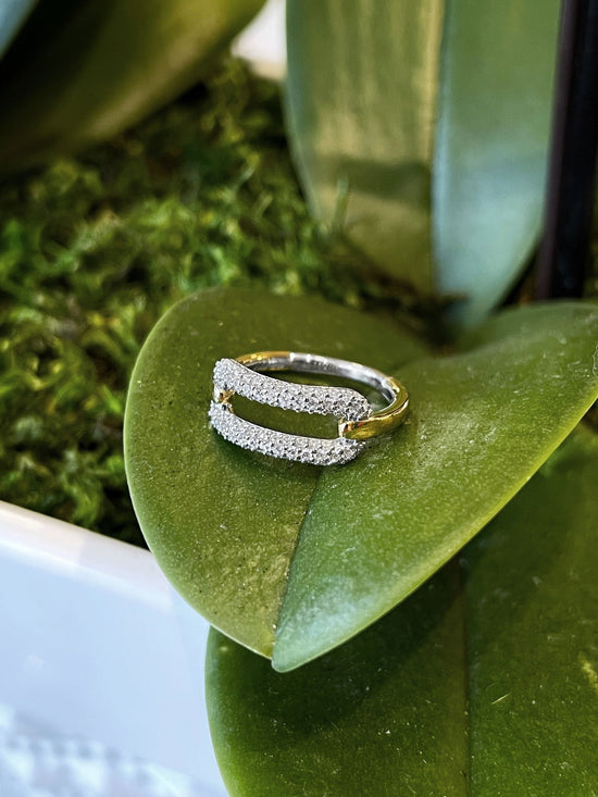Photo of Cubic Zirconia Oval Ring in a decorative scene, designed by , available at Plumb Gold & Plumb Silver