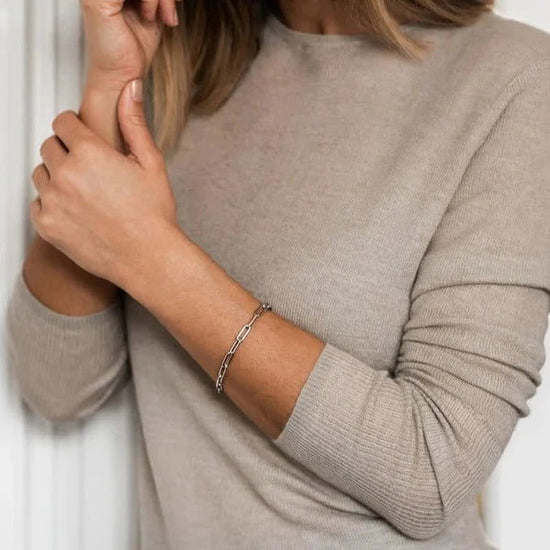 Photo of Cubic Zirconia Paperclip Link Bracelet in a decorative scene, designed by , available at Plumb Gold & Plumb Silver