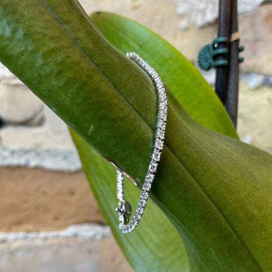 Photo of Cubic Zirconia Tennis Bracelet in a decorative scene, designed by , available at Plumb Gold & Plumb Silver