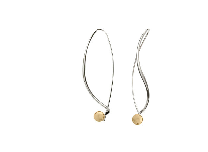 Photo of "Dangle" Earring in a decorative scene, designed by , available at Plumb Gold & Plumb Silver