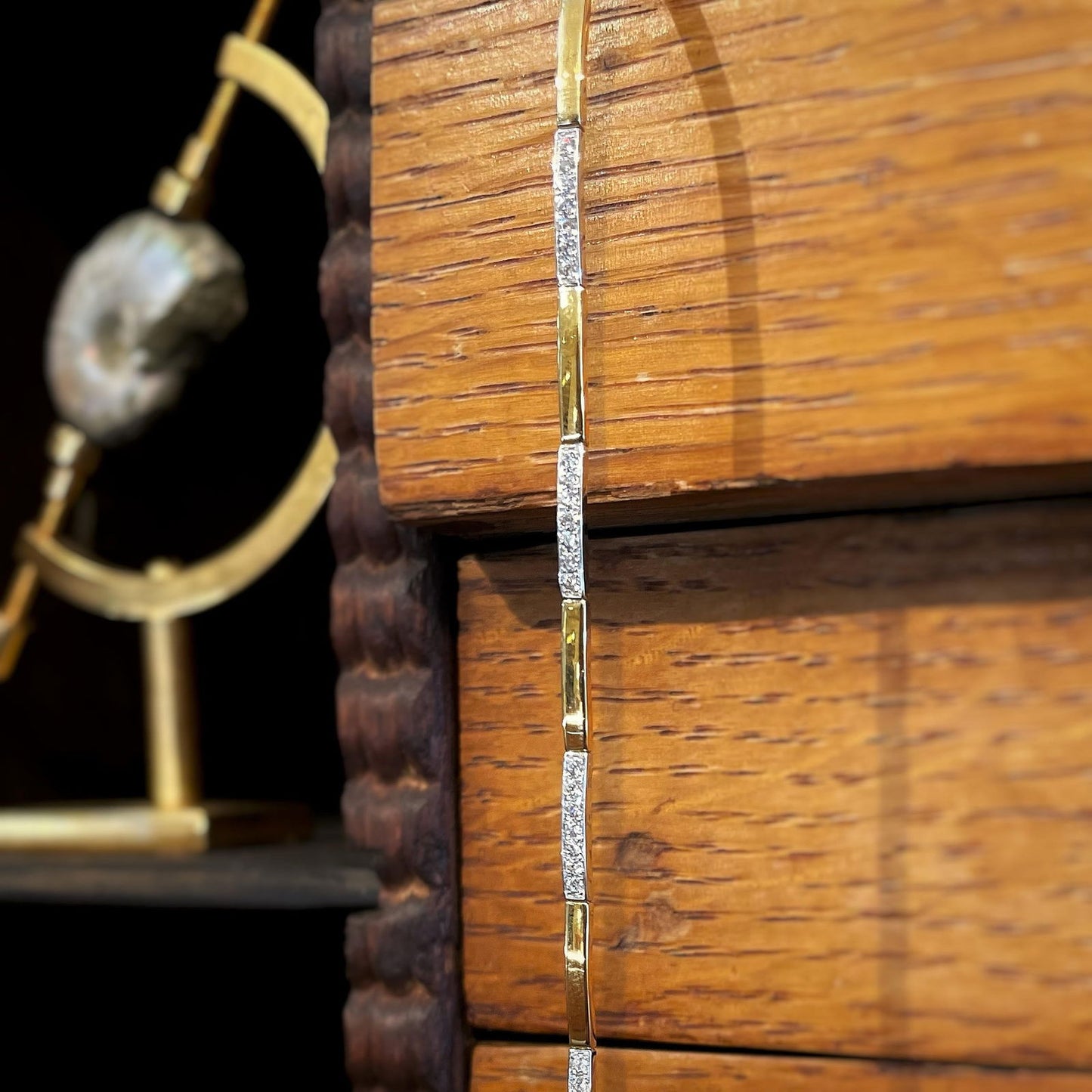 Photo of Diamond Bar Bracelet in a decorative scene, designed by , available at Plumb Gold & Plumb Silver