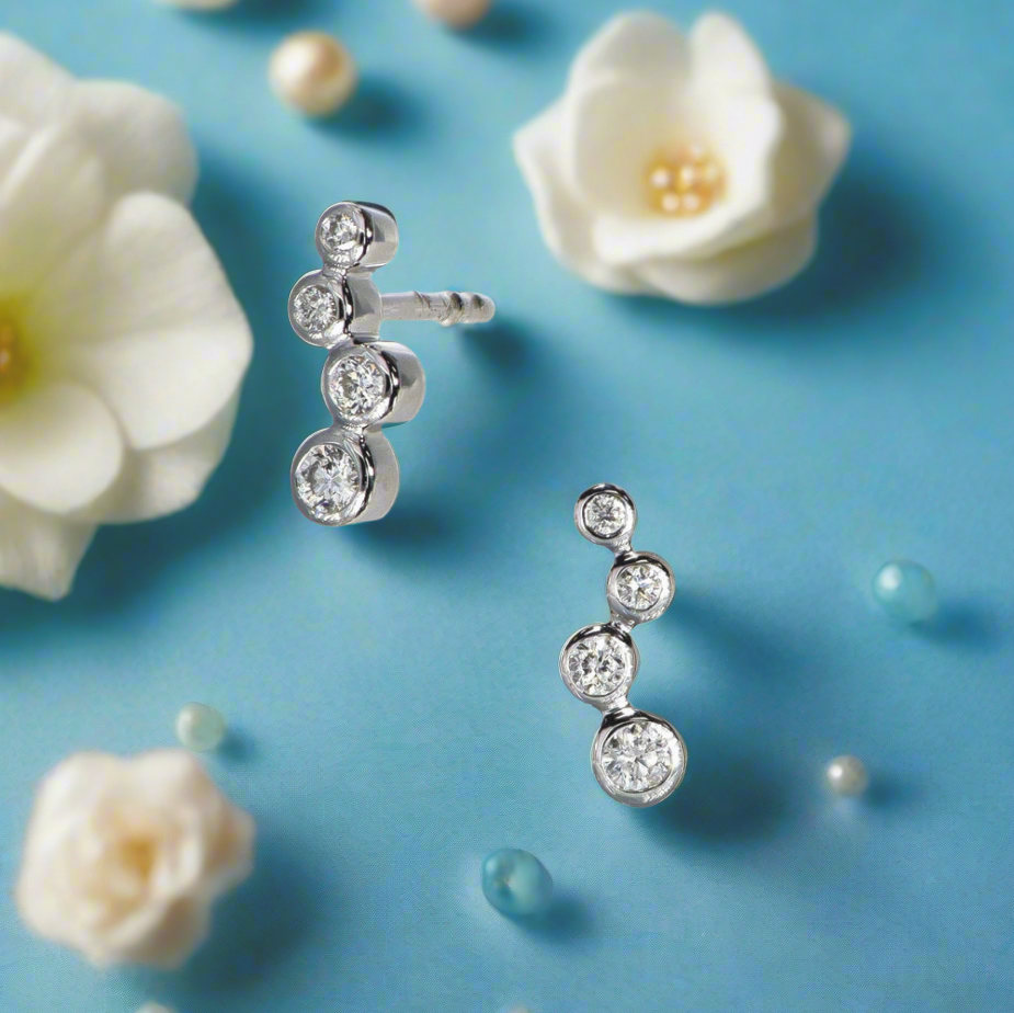 Photo of Diamond Bubbles Studs in a decorative scene, designed by , available at Plumb Gold & Plumb Silver