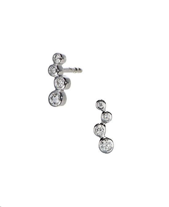 Photo of Diamond Bubbles Studs in a decorative scene, designed by , available at Plumb Gold & Plumb Silver