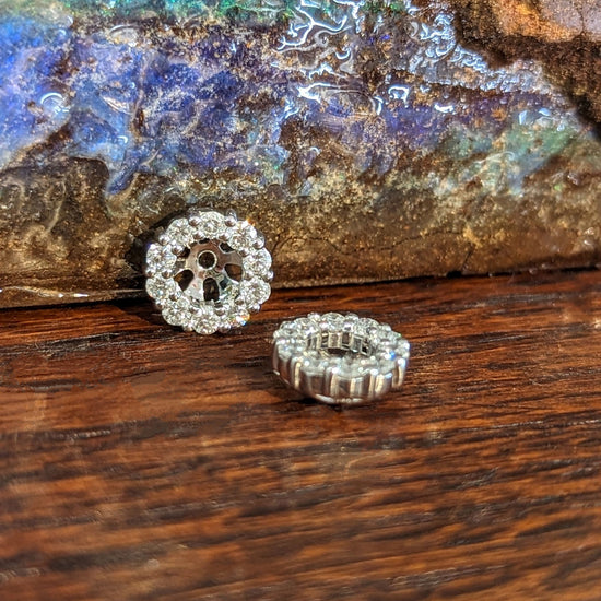 Photo of Diamond Earring Jackets in a decorative scene, designed by , available at Plumb Gold & Plumb Silver