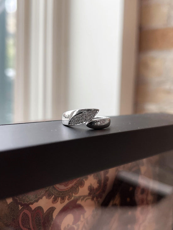 Photo of Diamond Leaf Ring in a decorative scene, designed by , available at Plumb Gold & Plumb Silver