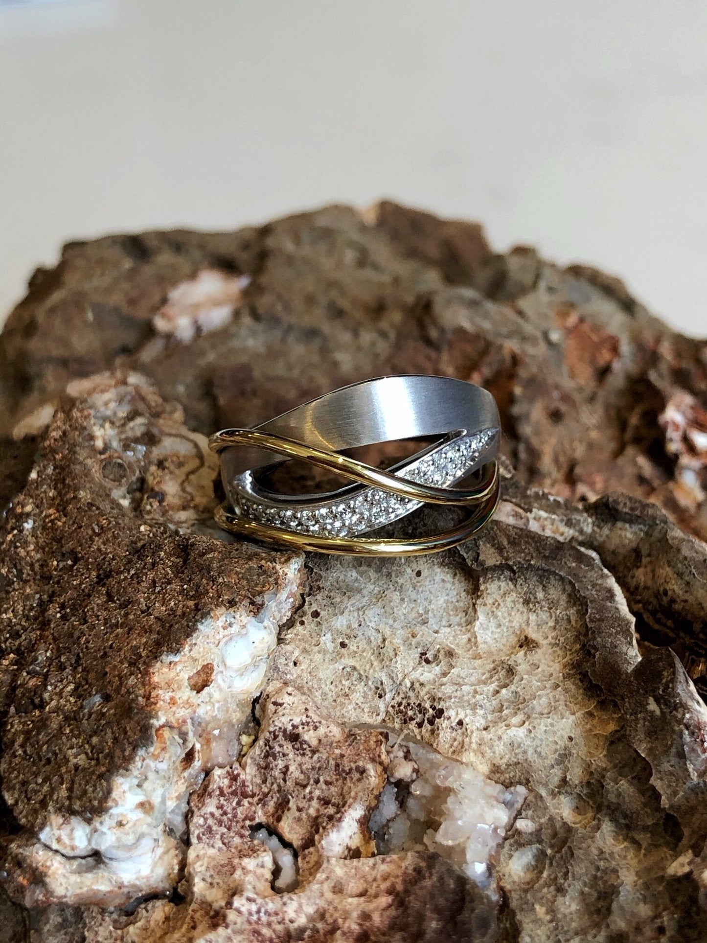 Photo of Diamond Matte Ring in a decorative scene, designed by , available at Plumb Gold & Plumb Silver
