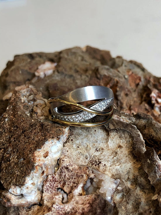Photo of Diamond Matte Ring in a decorative scene, designed by , available at Plumb Gold & Plumb Silver