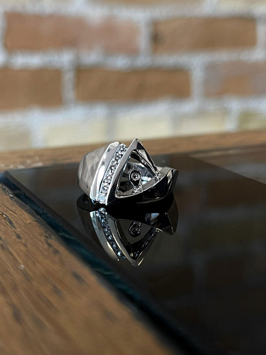 Photo of Diamond Ring Mounting in a decorative scene, designed by , available at Plumb Gold & Plumb Silver
