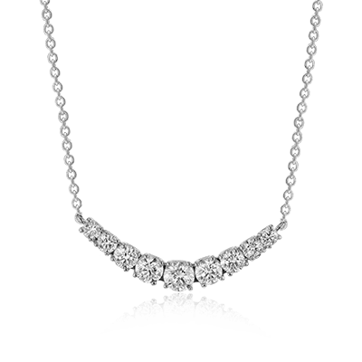 Photo of Diamond Smile Necklace in a decorative scene, designed by , available at Plumb Gold & Plumb Silver