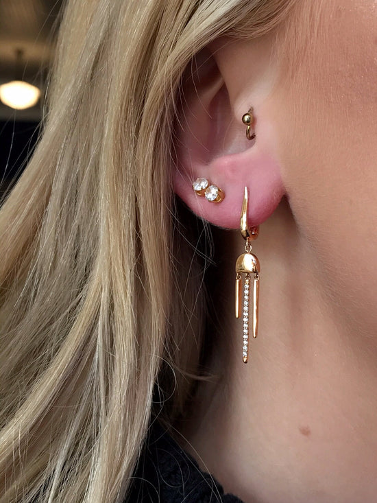 Photo of Diamond Stick Dangles in a decorative scene, designed by , available at Plumb Gold & Plumb Silver