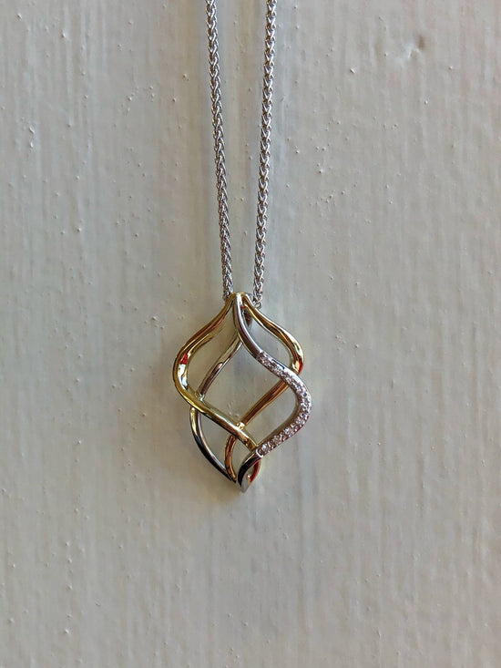 Photo of Double Open Pendant in a decorative scene, designed by , available at Plumb Gold & Plumb Silver