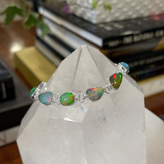 Photo of Dowdy Opal Bracelet in a decorative scene, designed by , available at Plumb Gold & Plumb Silver