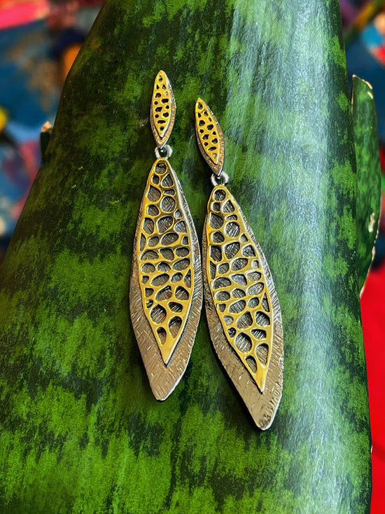 Photo of "Dragonfly" Earrings in a decorative scene, designed by , available at Plumb Gold & Plumb Silver
