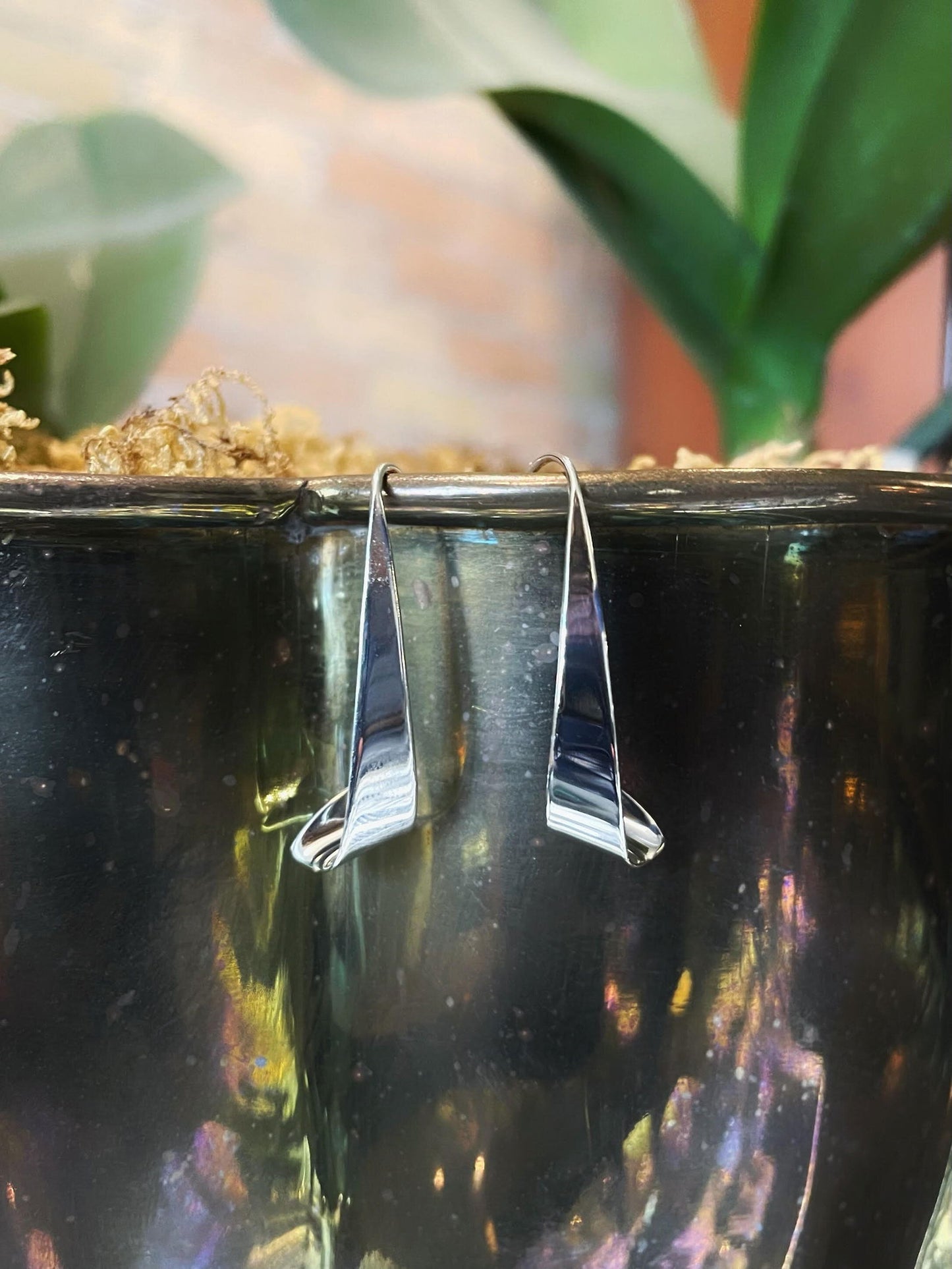 Photo of EL Designs "Windswept" Earrings in a decorative scene, designed by , available at Plumb Gold & Plumb Silver