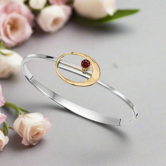 Photo of "Elliptical" Bracelet in a decorative scene, designed by , available at Plumb Gold & Plumb Silver