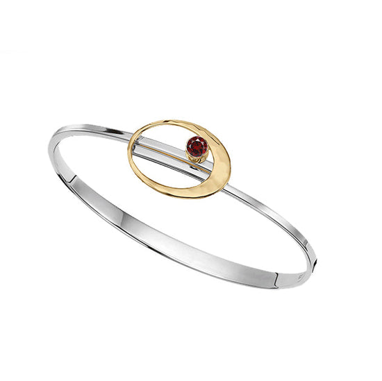 Photo of "Elliptical" Bracelet in a decorative scene, designed by , available at Plumb Gold & Plumb Silver