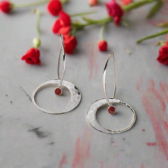 Photo of "Elliptical Elegance" Earrings in a decorative scene, designed by , available at Plumb Gold & Plumb Silver