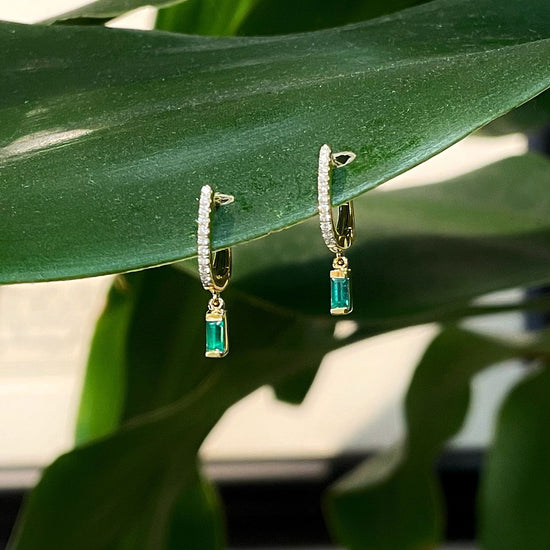 Photo of Emerald and Diamond Dangles in a decorative scene, designed by , available at Plumb Gold & Plumb Silver