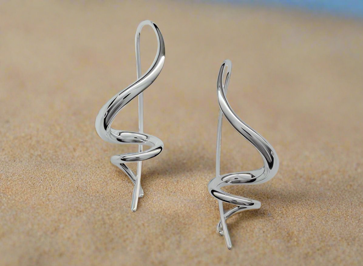 Photo of Encore Earrings in a decorative scene, designed by , available at Plumb Gold & Plumb Silver