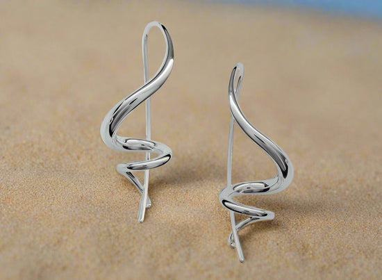 Photo of Encore Earrings in a decorative scene, designed by , available at Plumb Gold & Plumb Silver