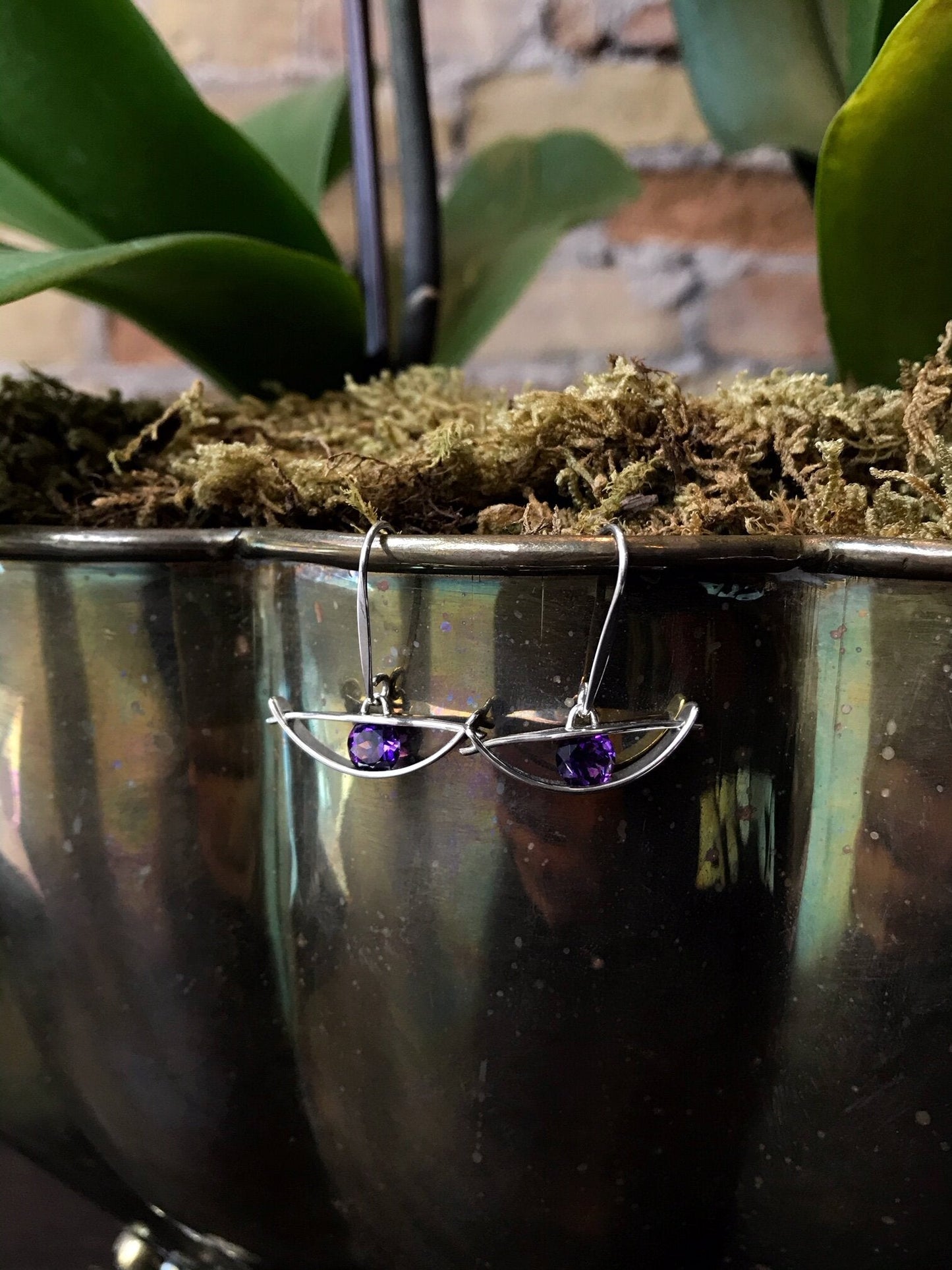 Photo of "Envision" Earrings in a decorative scene, designed by , available at Plumb Gold & Plumb Silver