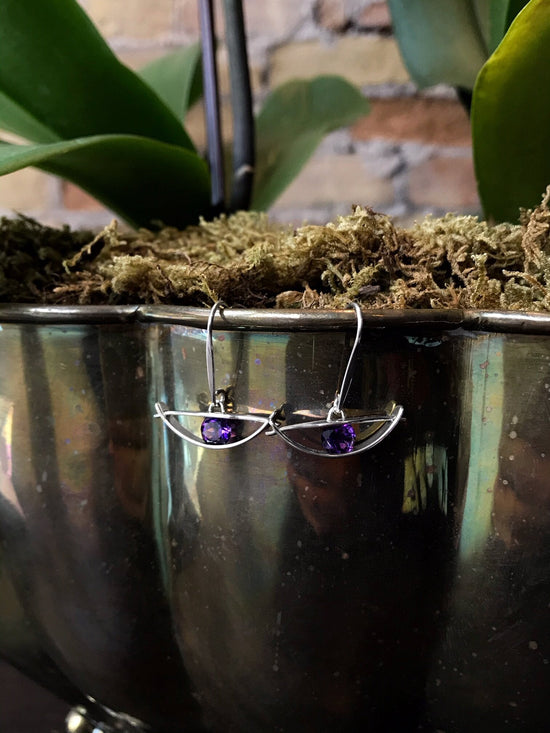 Photo of "Envision" Earrings in a decorative scene, designed by , available at Plumb Gold & Plumb Silver
