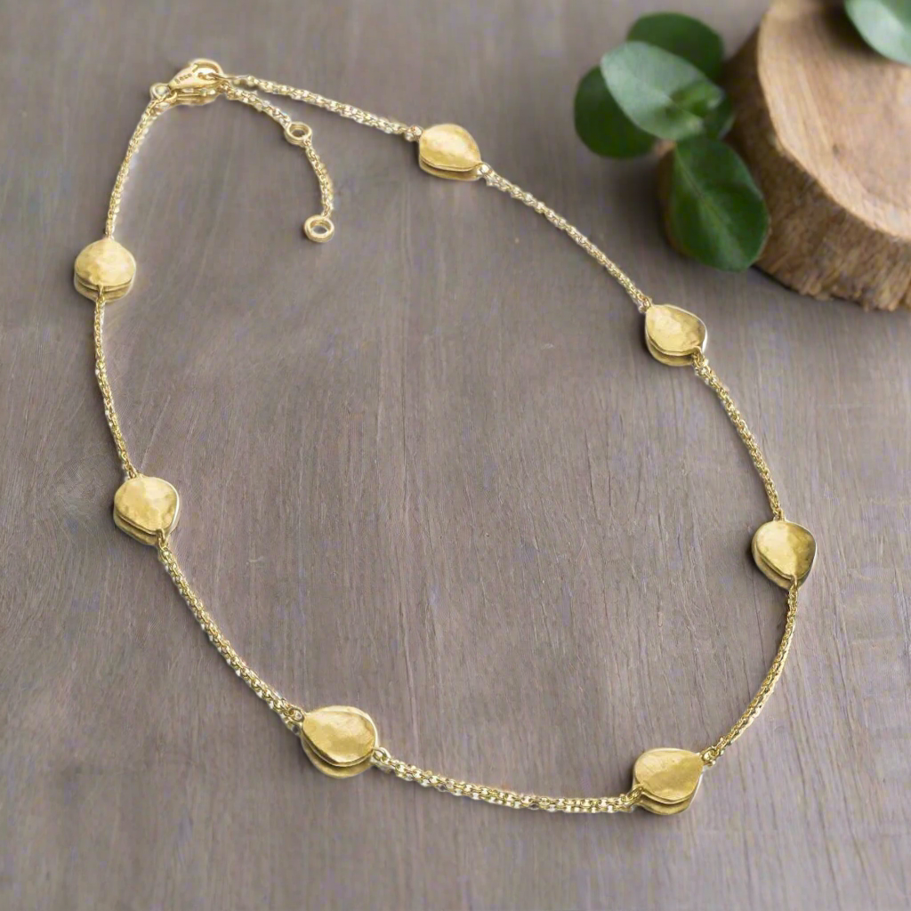 Photo of "Essential" Necklace in a decorative scene, designed by -, available at Plumb Gold & Plumb Silver