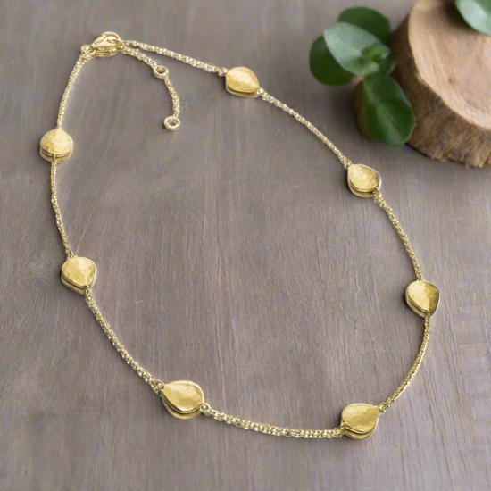 Photo of "Essential" Necklace in a decorative scene, designed by -, available at Plumb Gold & Plumb Silver