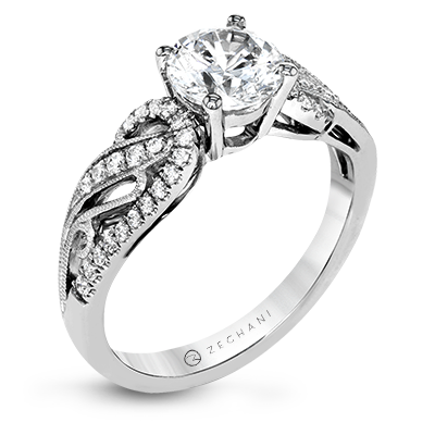 Photo of "Estella" Filigree Swirl Engagement Ring in a decorative scene, designed by , available at Plumb Gold & Plumb Silver