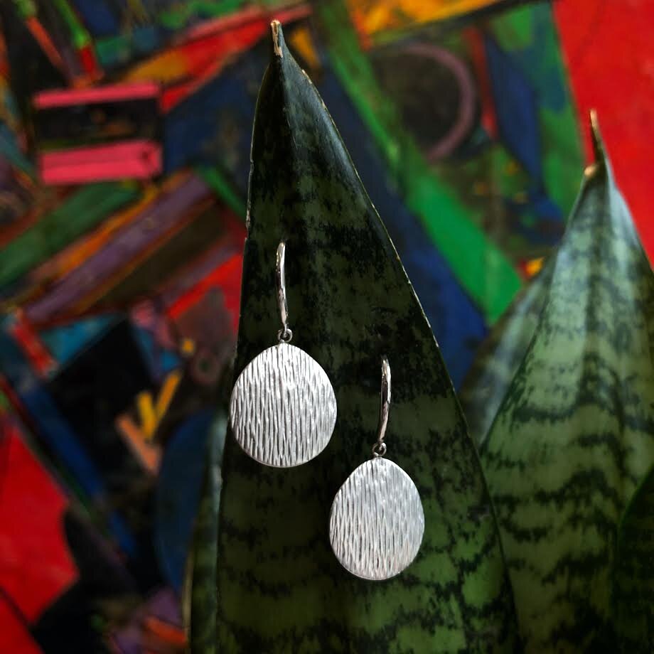 Photo of "Fall" Dangle Earring in a decorative scene, designed by , available at Plumb Gold & Plumb Silver