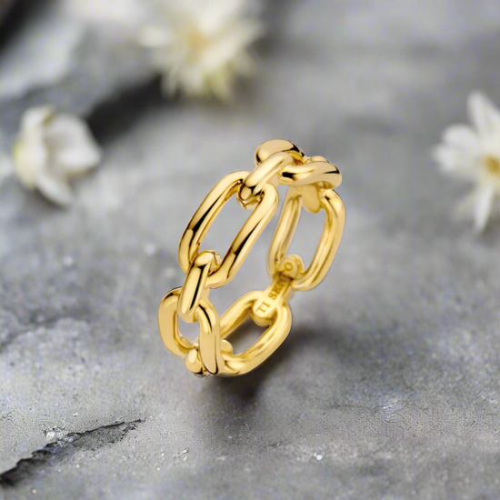 Photo of Fancy Link Ring in a decorative scene, designed by , available at Plumb Gold & Plumb Silver
