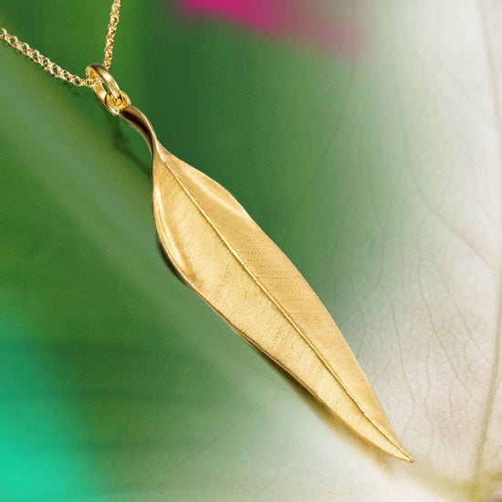 Photo of "Forest" Pendant in a decorative scene, designed by , available at Plumb Gold & Plumb Silver