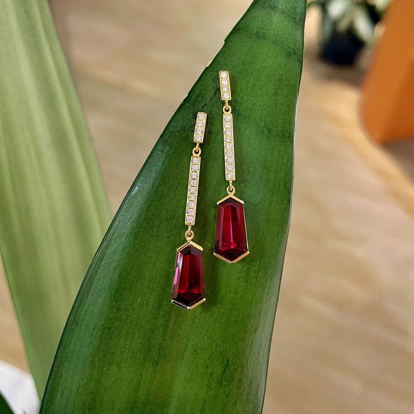 Photo of Garnet Diamond Dangles in a decorative scene, designed by , available at Plumb Gold & Plumb Silver