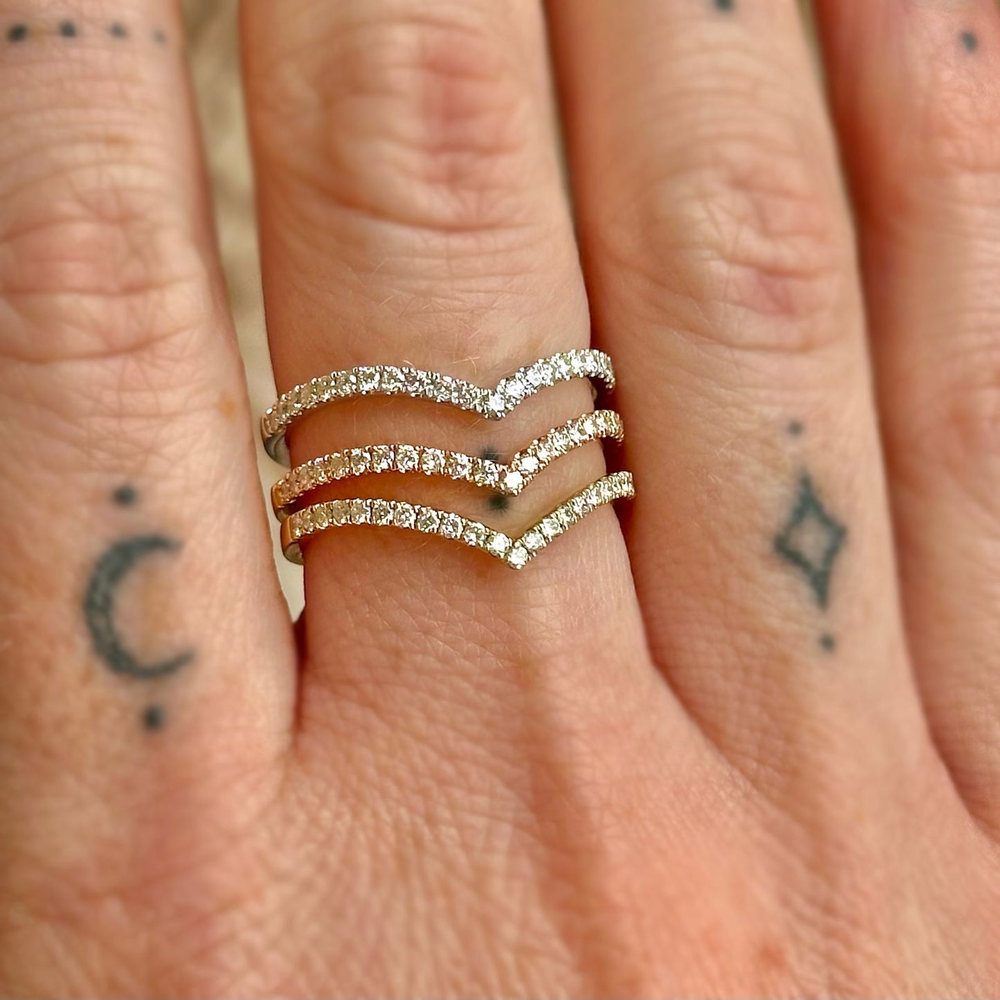 Photo of "Gigi" Chevron Diamond Band in a decorative scene, designed by -, available at Plumb Gold & Plumb Silver