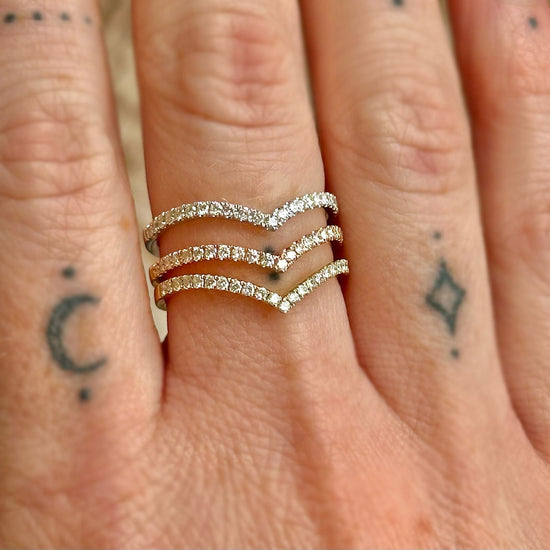 Photo of "Gigi" Chevron Diamond Band in a decorative scene, designed by -, available at Plumb Gold & Plumb Silver