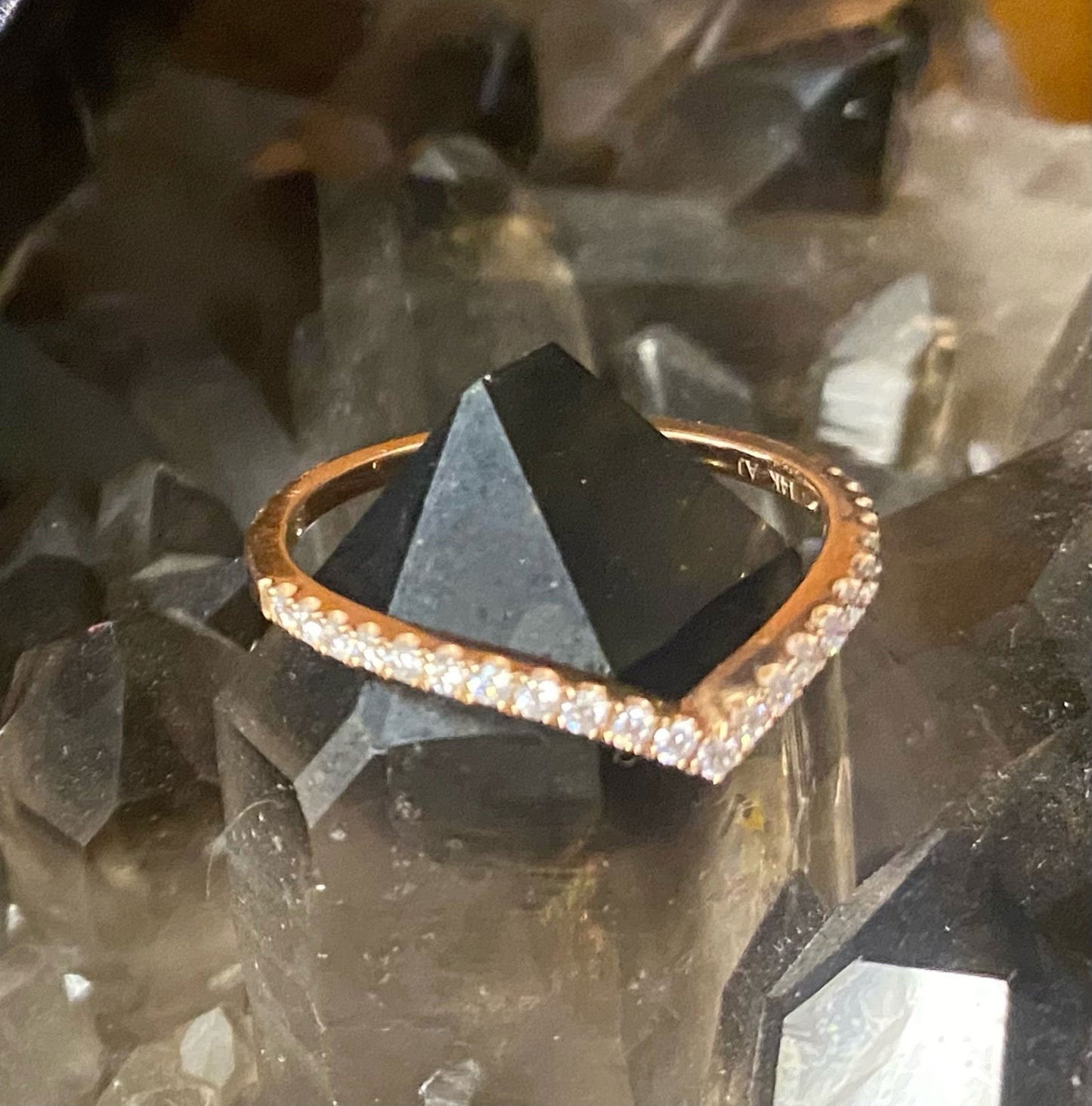 Photo of "Gigi" Chevron Diamond Band in a decorative scene, designed by , available at Plumb Gold & Plumb Silver