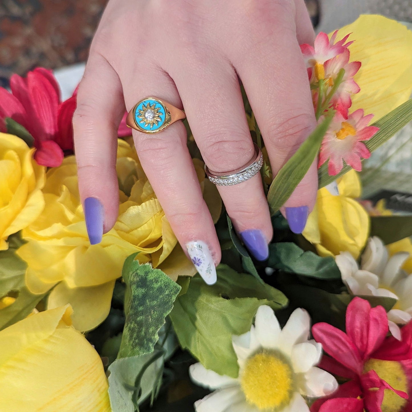 Photo of Gold Plated Turquoise Sunburst Ring in a decorative scene, designed by , available at Plumb Gold & Plumb Silver