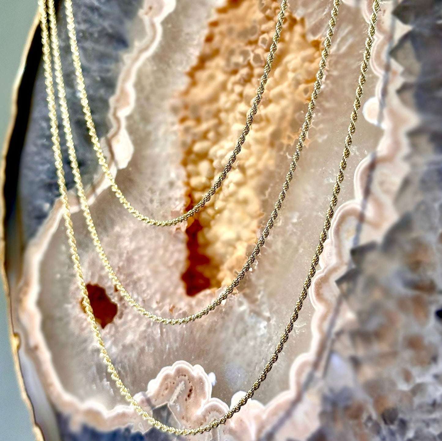 Photo of Gold Rope Chain in a decorative scene, designed by , available at Plumb Gold & Plumb Silver