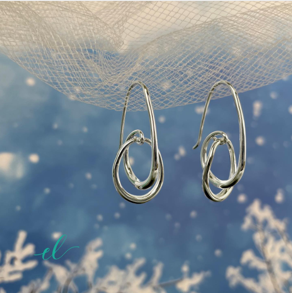 Photo of "Halo" Earrings in a decorative scene, designed by , available at Plumb Gold & Plumb Silver