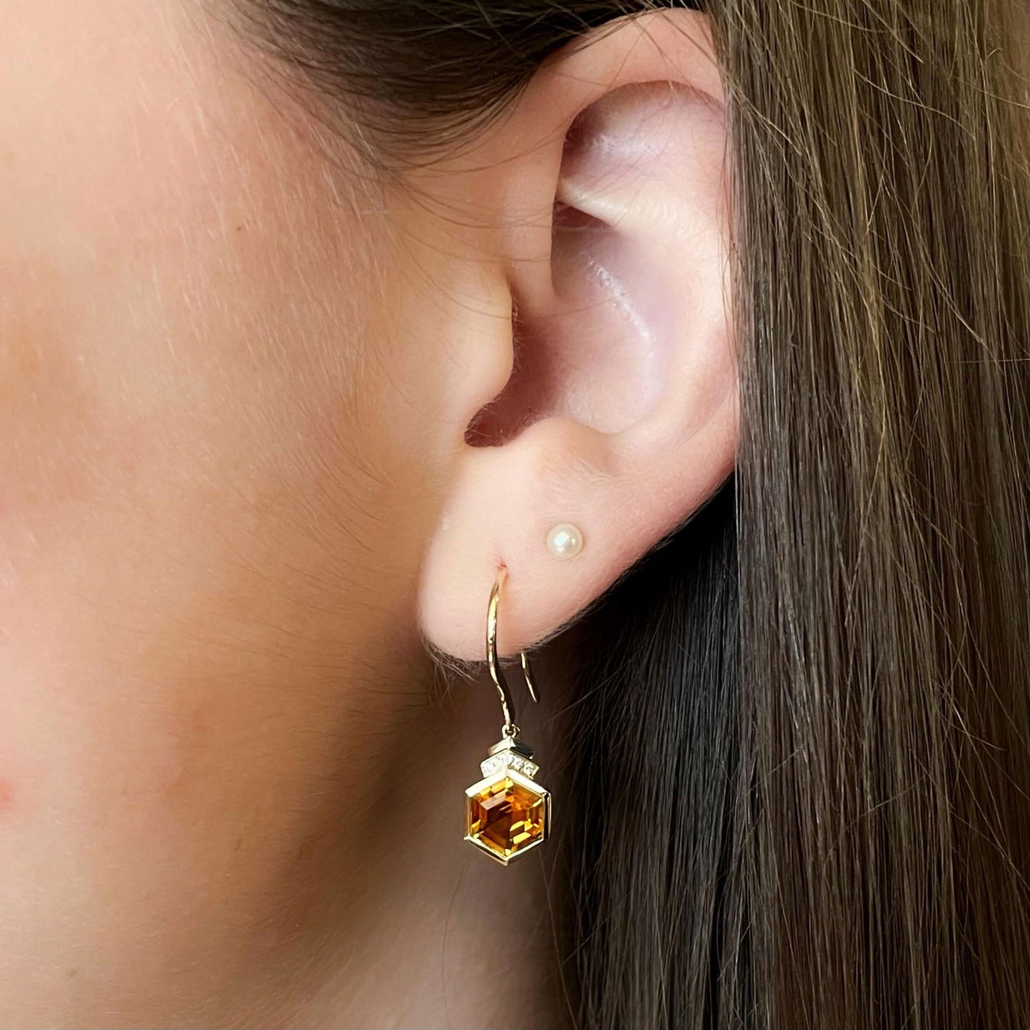 Photo of Hexagon Citrine Diamond Dangles in a decorative scene, designed by , available at Plumb Gold & Plumb Silver