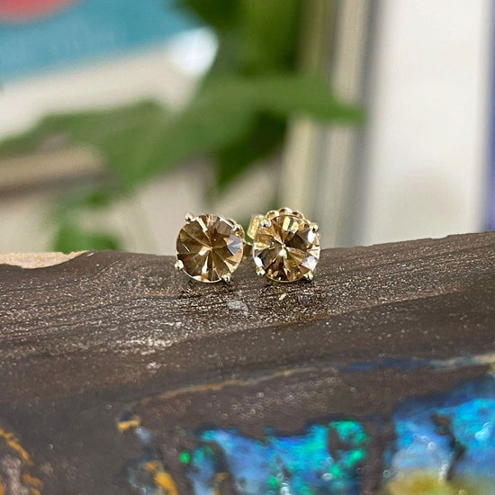 Photo of Imperial Topaz Studs in a decorative scene, designed by -, available at Plumb Gold & Plumb Silver